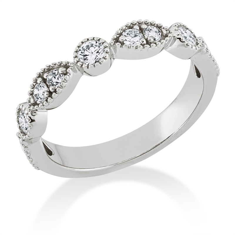 Ring 18 kt WG, 3 Brill. 0,27 ct, W-si, 8 Brill. 0,35 ct, W-si
