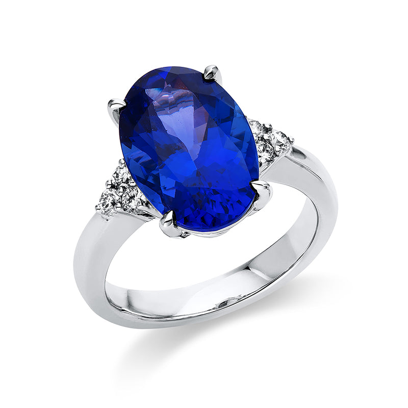 Ring 18 kt WG, 6 Brill. 0,24 ct, TW-si, 1 Tansanit 6,99 ct blau
