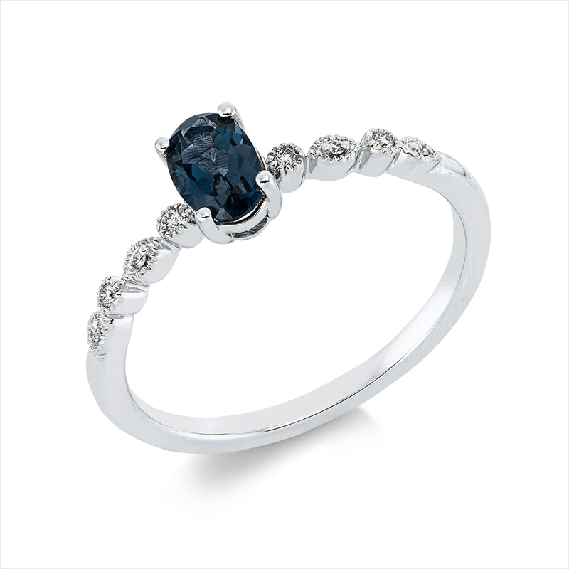 Ring 18 kt WG, 8 Brill. 0,03 ct, TW-si, 1 Topas 0,60 ct Lond. blue