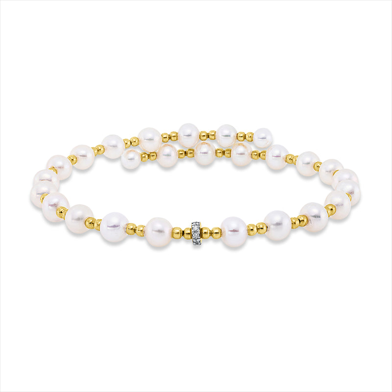 Armreif 18 kt GG, Fassung rhodiniert, 10 Brill. 0,05 ct, TW-si, 24 SW weiß 4,5 mm, 2 SW weiß 4 mm