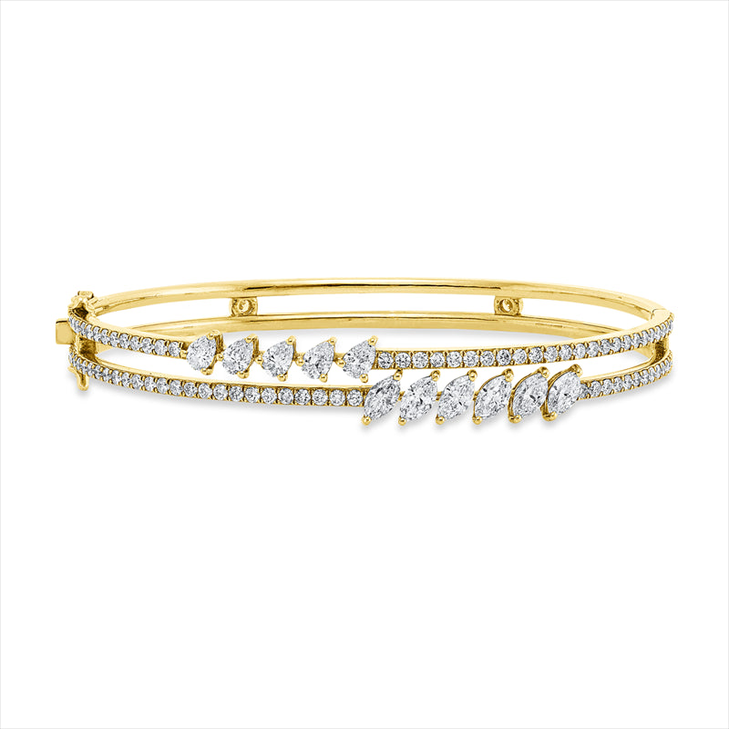 Armreif 18 kt GG+WG, 6 Nav. 1,14 ct, 5 Tropfen 0,67 ct, 82 Brill. 1,32 ct, TW-si