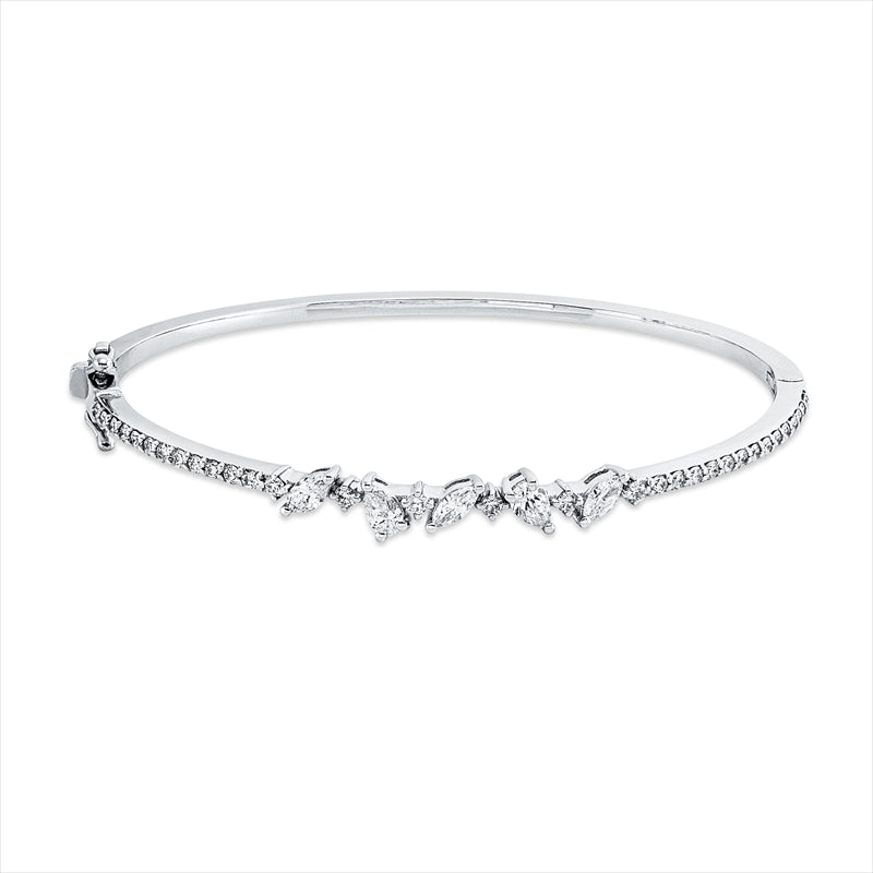 Armreif 18 kt WG, 3 Nav. 0,32 ct, F/TW-si, 2 Tropfen 0,34 ct, F/TW-si, 32 Brill. 0,68 ct, F/TW-si
