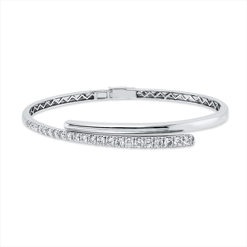 Armreif 14 kt WG, 7 Brill. 0,32 ct, TW-pi, 10 Brill. 0,60 ct, TW-pi, 3 Brill. 0,24 ct, TW-pi, 2 Brill. 0,08 ct, TW-pi