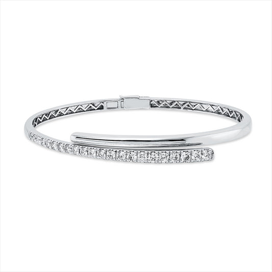 Armreif 14 kt WG, 7 Brill. 0,32 ct, TW-pi, 10 Brill. 0,60 ct, TW-pi, 3 Brill. 0,24 ct, TW-pi, 2 Brill. 0,08 ct, TW-pi