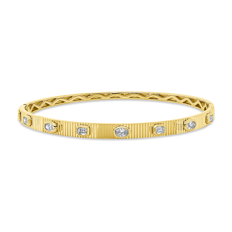 Armreif 18 kt GG, 3 Oval 0,29 ct, TW-si, 4 Bag. 0,40 ct, TW-si