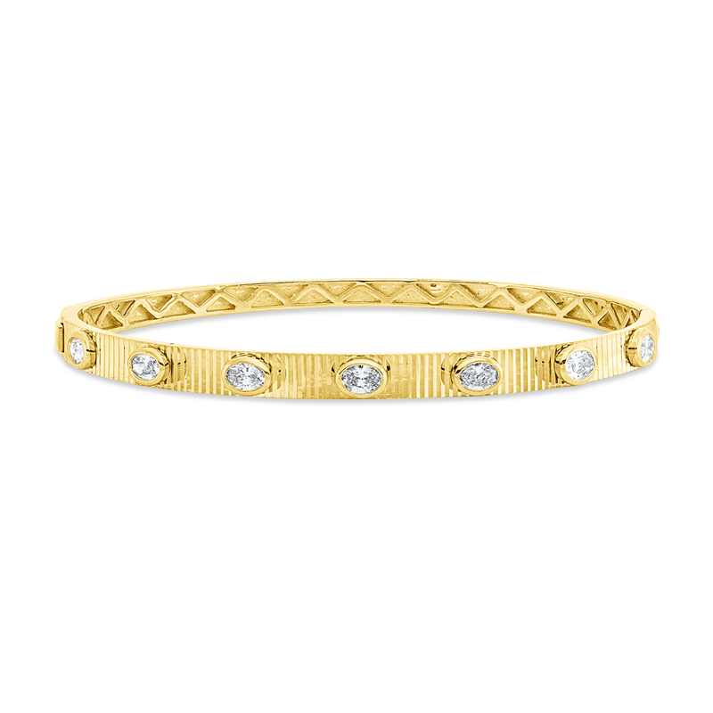 Armreif 18 kt GG, 7 Oval 0,73 ct, TW-si