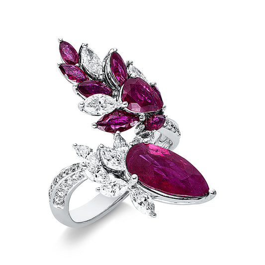 Ring 18 kt WG, 10 Nav. 0,98 ct, TW-si, 27 Brill. 0,18 ct, TW-si, 1 Rubin 2,55 ct rot, 8 Rubine 1,66 ct rot