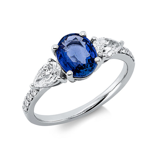 Ring 18 kt WG, 2 Tropfen 0,55 ct, TW-si, 8 Brill. 0,10 ct, TW-pi, 1 Saphir 1,42 ct blau