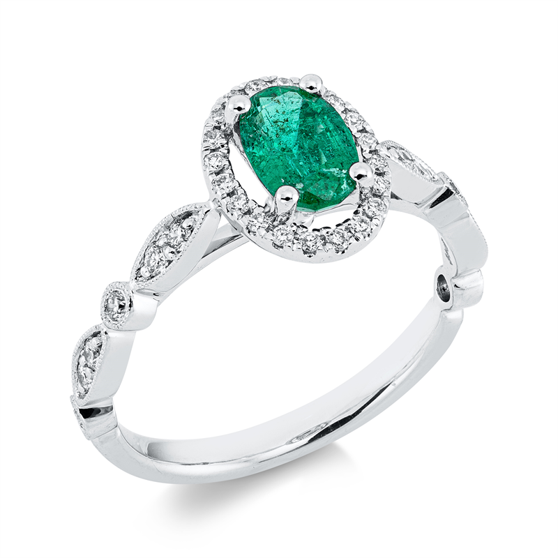 Ring 18 kt WG, 32 Brill. 0,26 ct, TW-si, 1 Smaragd 0,57 ct grün