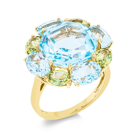 Ring 18 kt GG, 4 Topase 3,80 ct sky blue, 1 Topas 9,80 ct sky blue, 4 Peridot 1,60 ct grün