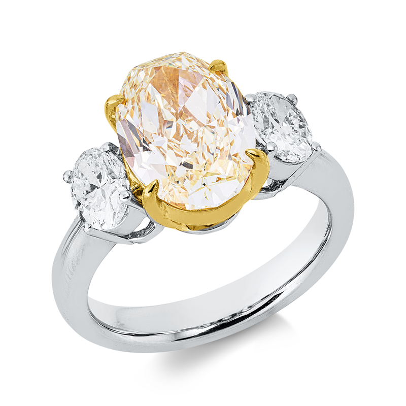 Ring 18 kt WG+GG, GIA 2225513815, 1 Oval 4,14 ct, gelb-if, 2 Oval 0,95 ct, TW-si