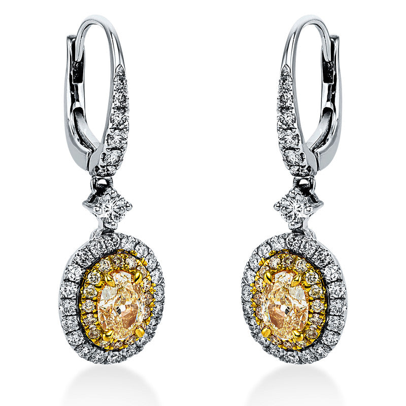 Ohrschmuck 18 kt WG+GG, 54 Brill. 0,63 ct, TW-si, 2 Oval 1,04 ct, gelb, 32 Brill. 0,16 ct, gelb