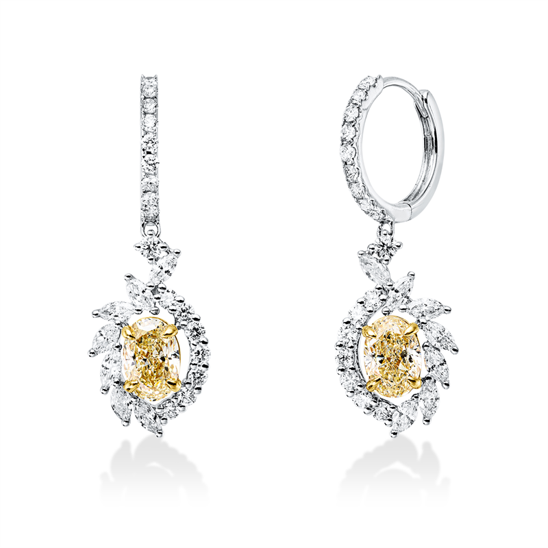 Ohrschmuck 18 kt WG+GG, 14 Nav. 0,42 ct, F-vsi/si, 34 Brill. 0,42 ct, F-vsi/si, 2 Oval 1,06 ct, gelb