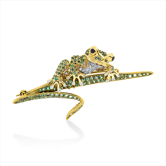 Brosche 18 kt WG+GG, Fassung teils schwarz rhodinie, 37 Brill. 0,38 ct, TW-vsi, 2 Brill. 0,07 ct, schwarz, 33 Saphire 0,42 ct gelb, 155 Tsavorith 2,43 ct grün