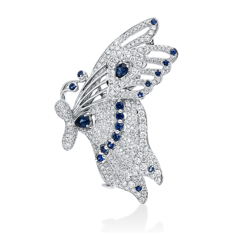 Brosche 18 kt WG, 2 Saphire 0,50 ct blau, 18 Saphire 0,49 ct blau, 359 Brill. 2,16 ct, TW-si