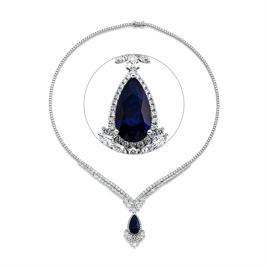 Collier 18 kt WG, 48 Nav. 3,67 ct, 2 Tropfen 0,22 ct, 35 Brill. 1,94 ct, TW-si, 1 Saphir 4,38 ct blau