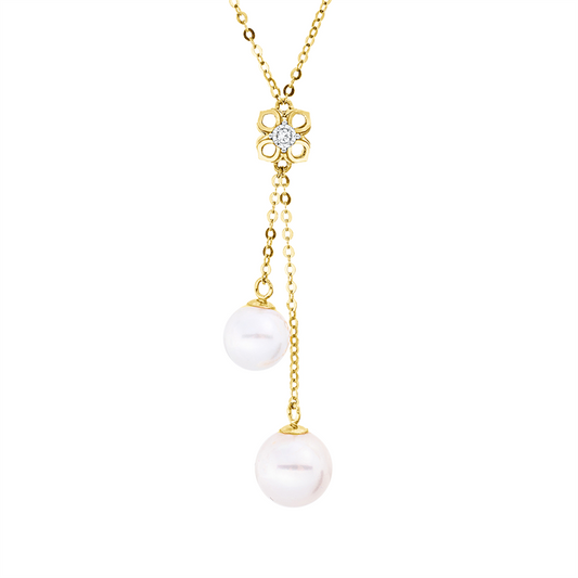 Collier 18 kt GG, mit Silikonverschluss bei 38, 1 Brill. 0,02 ct, TW-si, 1 Perlmutt gold, 1 SW weiß 5 mm, 1 SW weiß 7 mm, 1 SW weiß 8 mm