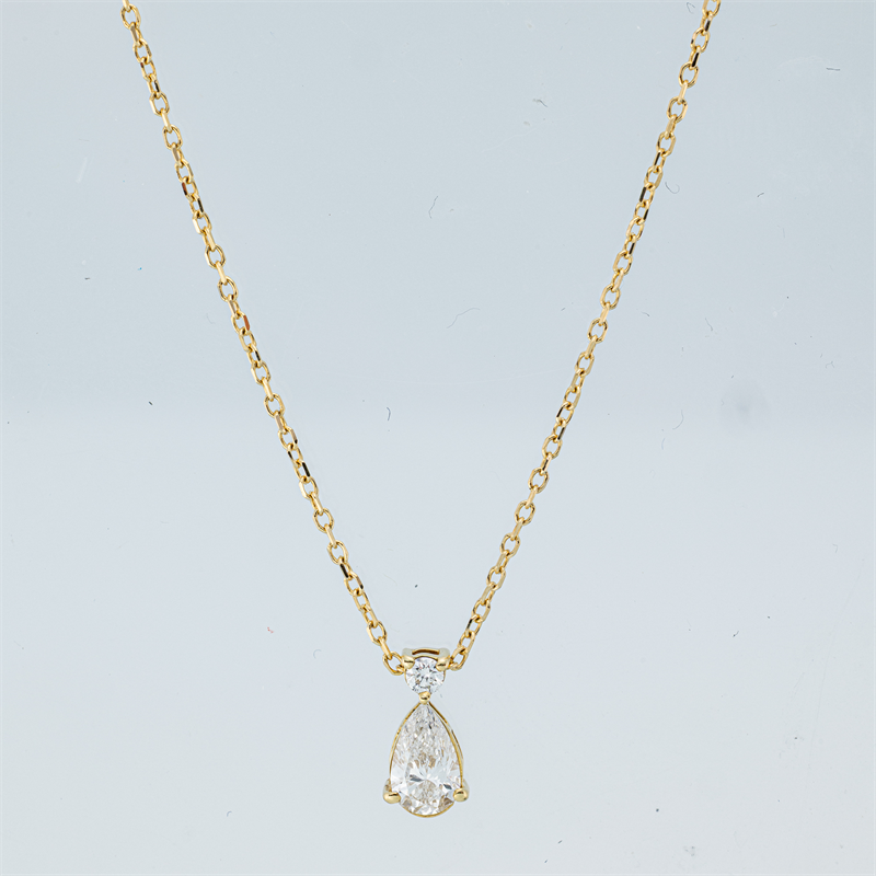 Collier 18 kt GG, mit ZÖ 40 cm + 42 cm, 1 Tropfen 0,30 ct, TW-si, 1 Brill. 0,04 ct, TW-si