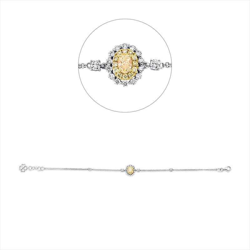 Armband 18 kt WG+GG,  12 Brill. 0,10 ct, 1 Oval 0,34 ct, gelb, 4 Brill. 0,20 ct, 14 Brill. 0,18 ct, TW-si