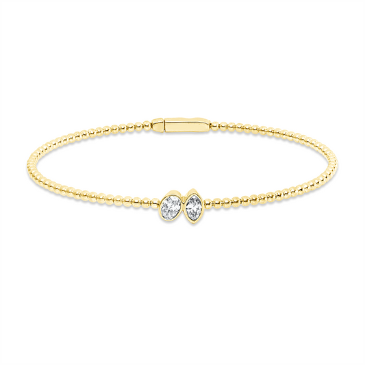 Armreif 18 kt GG, 1 Oval 0,22 ct, TW-si, 1 Nav. 0,17 ct, TW-si