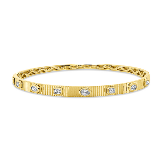 Armreif 18 kt GG, 3 Oval 0,29 ct, TW-si, 4 Bag. 0,40 ct, TW-si
